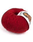 Close-up of BeMe Cardinal Red yarn texture, 100% Peruvian wool