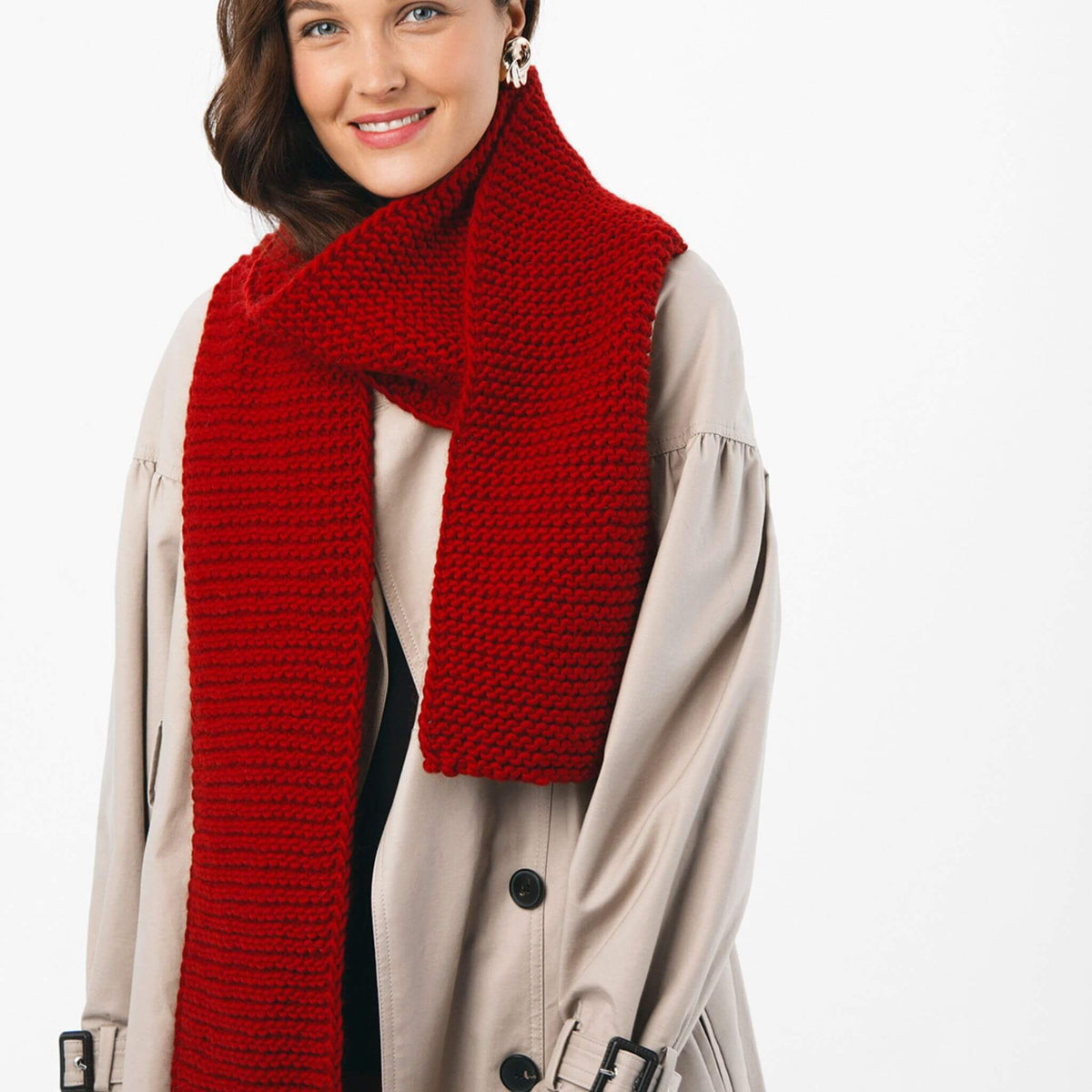 BeMe Cardinal Red wool yarn next to other shades of The Woolcatcher collection